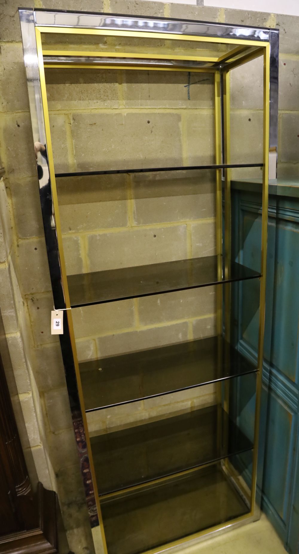 A pair of contemporary chrome and gilt shelving units, width 76cm, depth 38cm, height 202cm